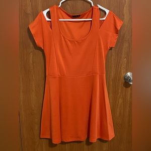 Rust orange skater dress with shoulder cut-outs.